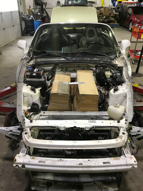 Test-fitting how the batteries will fit into the front of the car.